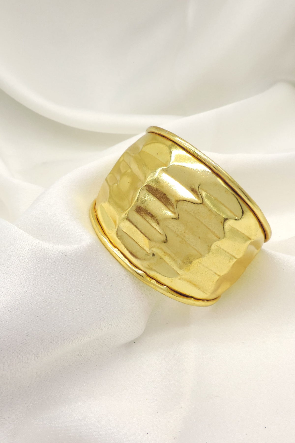 Polished gold wide cuff bracelet by Joyrias