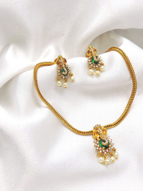 Regal gold-toned temple green stone pearl necklace set with matching earrings by joyrias