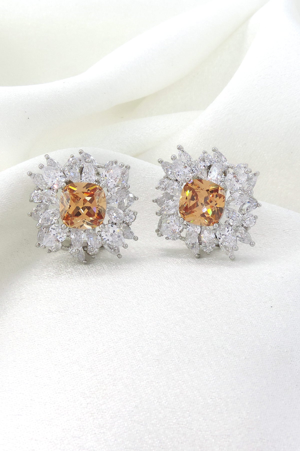 Champagne cushion AD CZ halo stud earrings by Joyrias