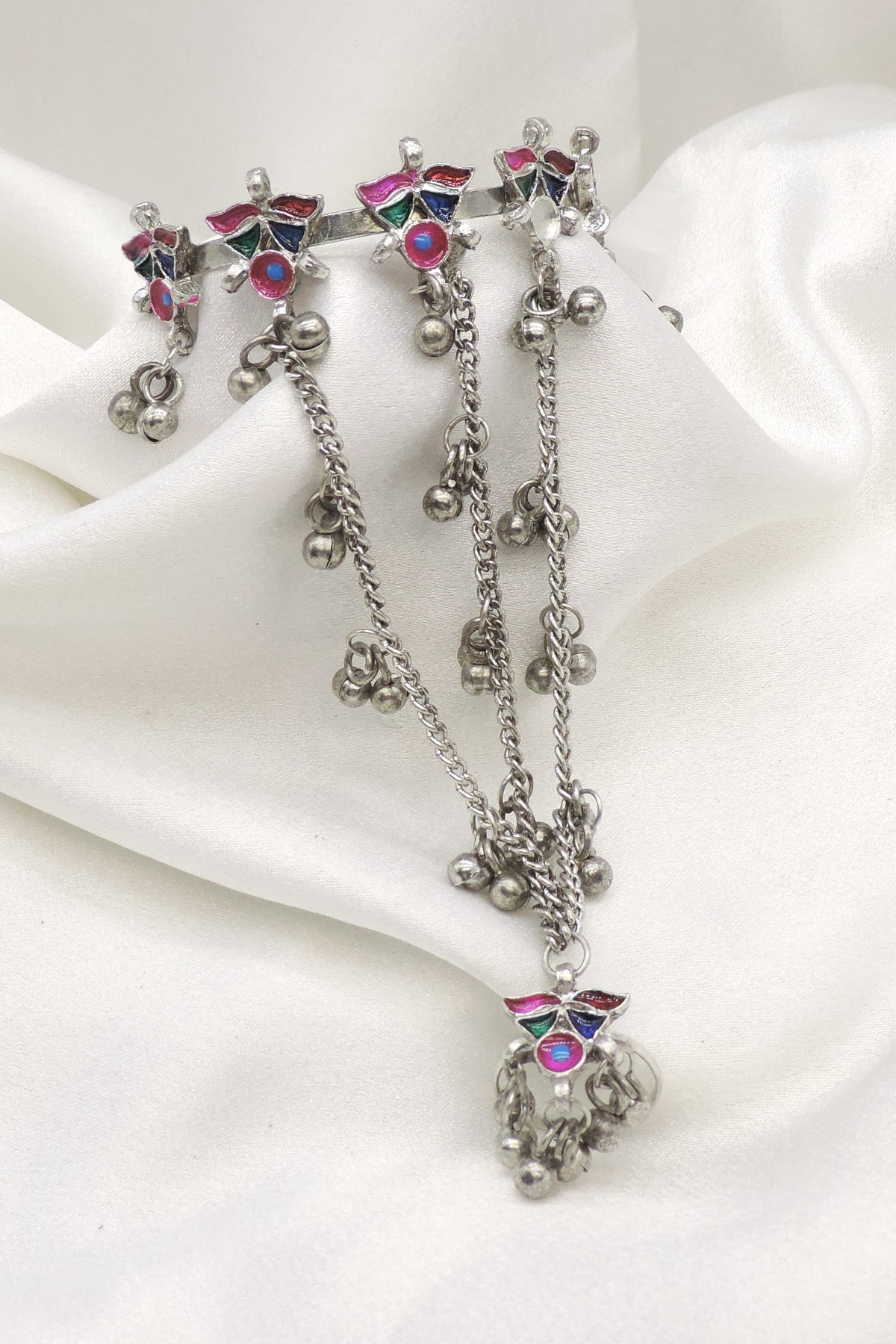 Oxidized silver multicolor hath phool with floral motifs, hand chains, and dangling silver bead charms by joyrias