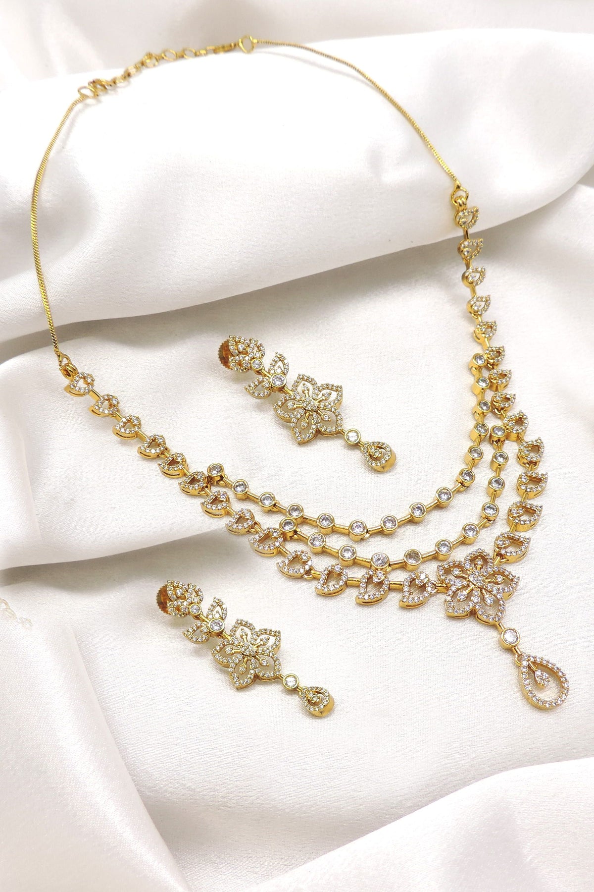 Traditional temple AD CZ cluster necklace set with layered floral design and matching earrings by joyrias