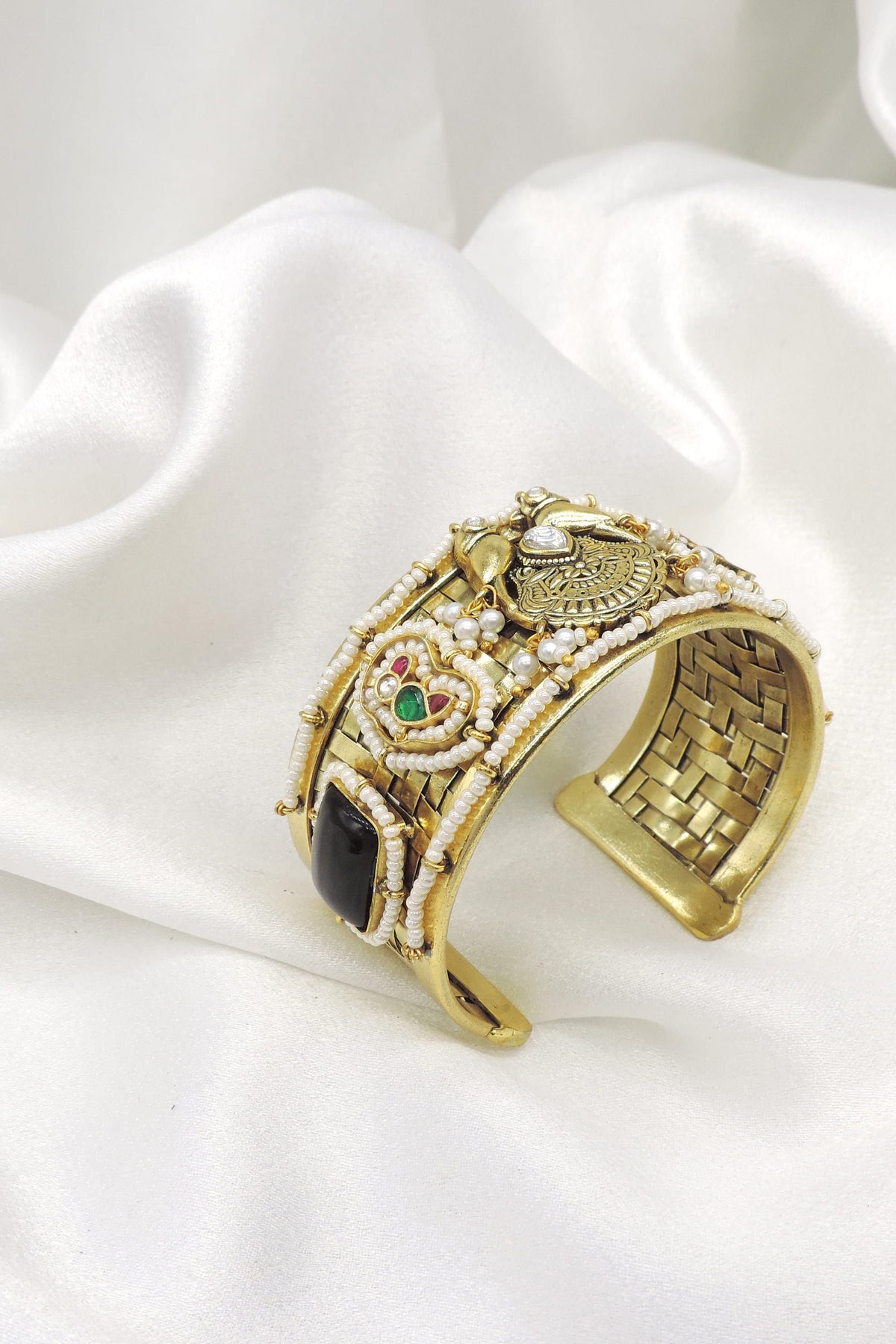 Gold-toned black stone pearl temple cuff bracelet with intricate floral detailing by joyrias