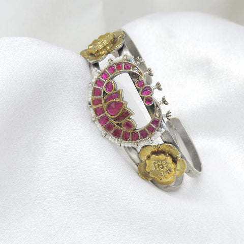 Dual-tone silver gold pink lotus cuff bracelet with pearl edging and floral detailing by joyrias