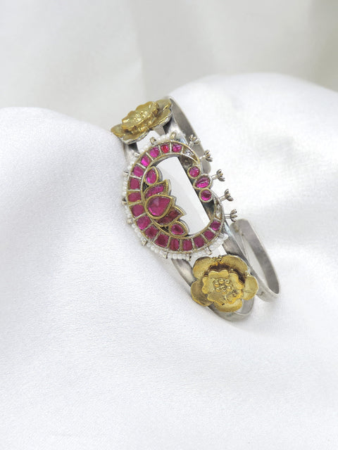 Dual-tone silver gold pink lotus cuff bracelet with pearl edging and floral detailing by joyrias