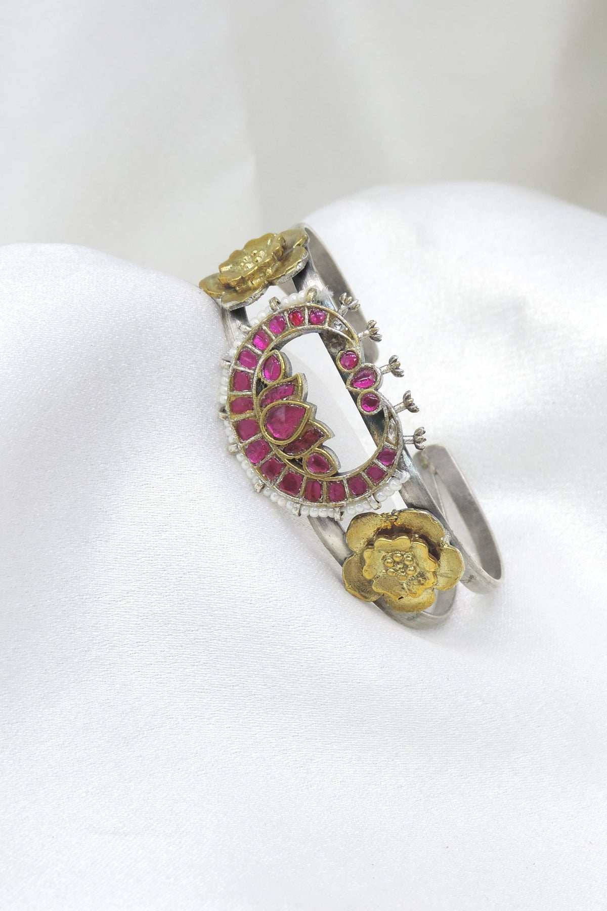 Dual-tone silver gold pink lotus cuff bracelet with pearl edging and floral detailing by joyrias