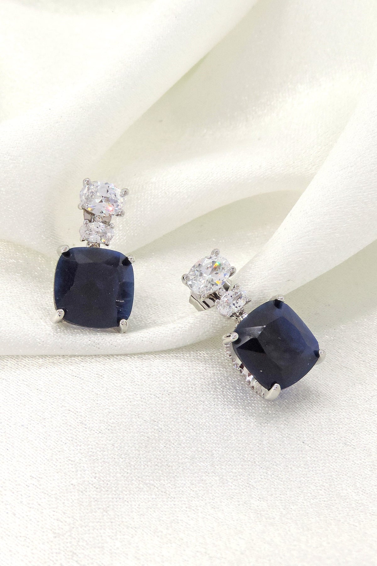 Navy blue cushion CZ drop stud earrings by Joyrias