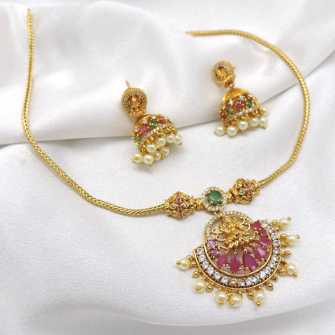 Antique ruby emerald temple necklace set with Lakshmi pendant, pearl detailing and matching jhumka earrings by joyrias