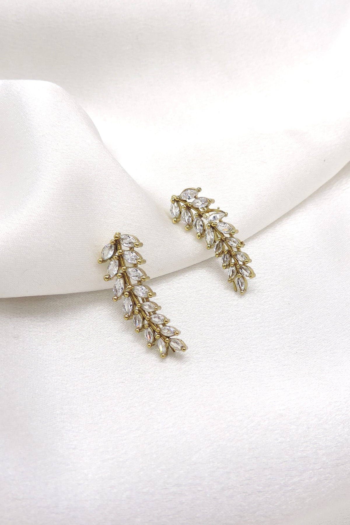 Gold-toned AD CZ leaf dangler earrings with cascading floral detailing by joyrias