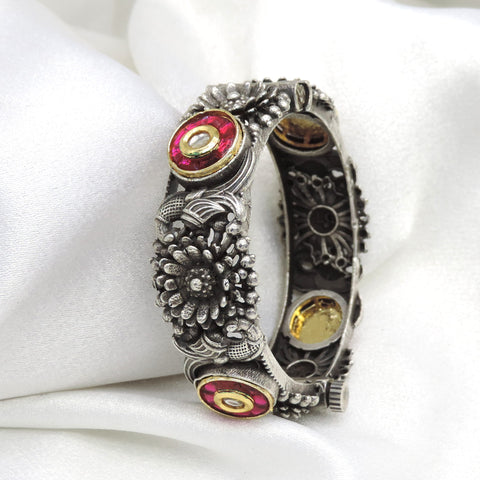 Oxidized silver red stone floral cuff bracelet with intricate traditional detailing by joyrias