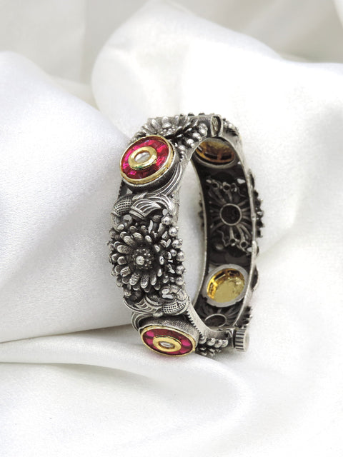 Oxidized silver red stone floral cuff bracelet with intricate traditional detailing by joyrias