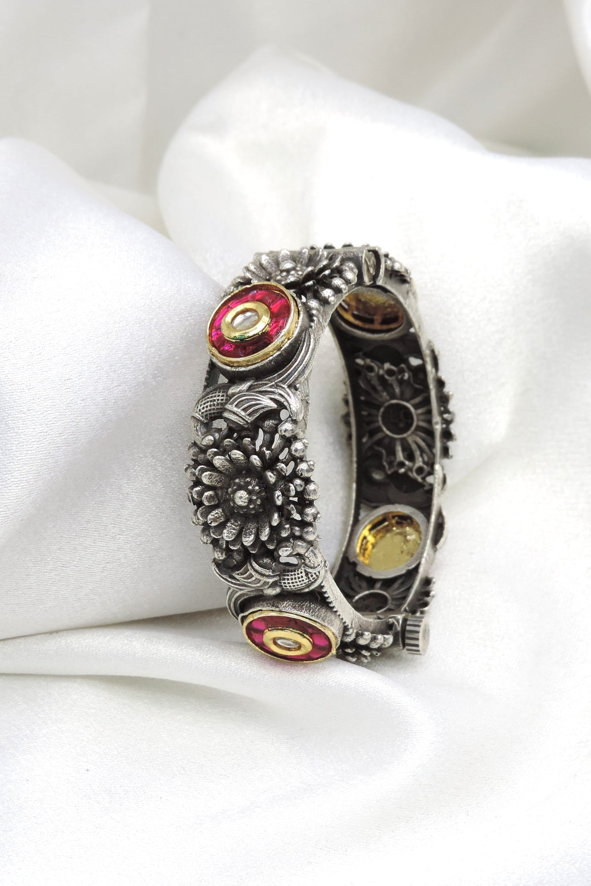 Oxidized silver red stone floral cuff bracelet with intricate traditional detailing by joyrias