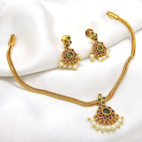 Royal gold-toned temple necklace set with green and ruby stones and pearl detailing by joyrias