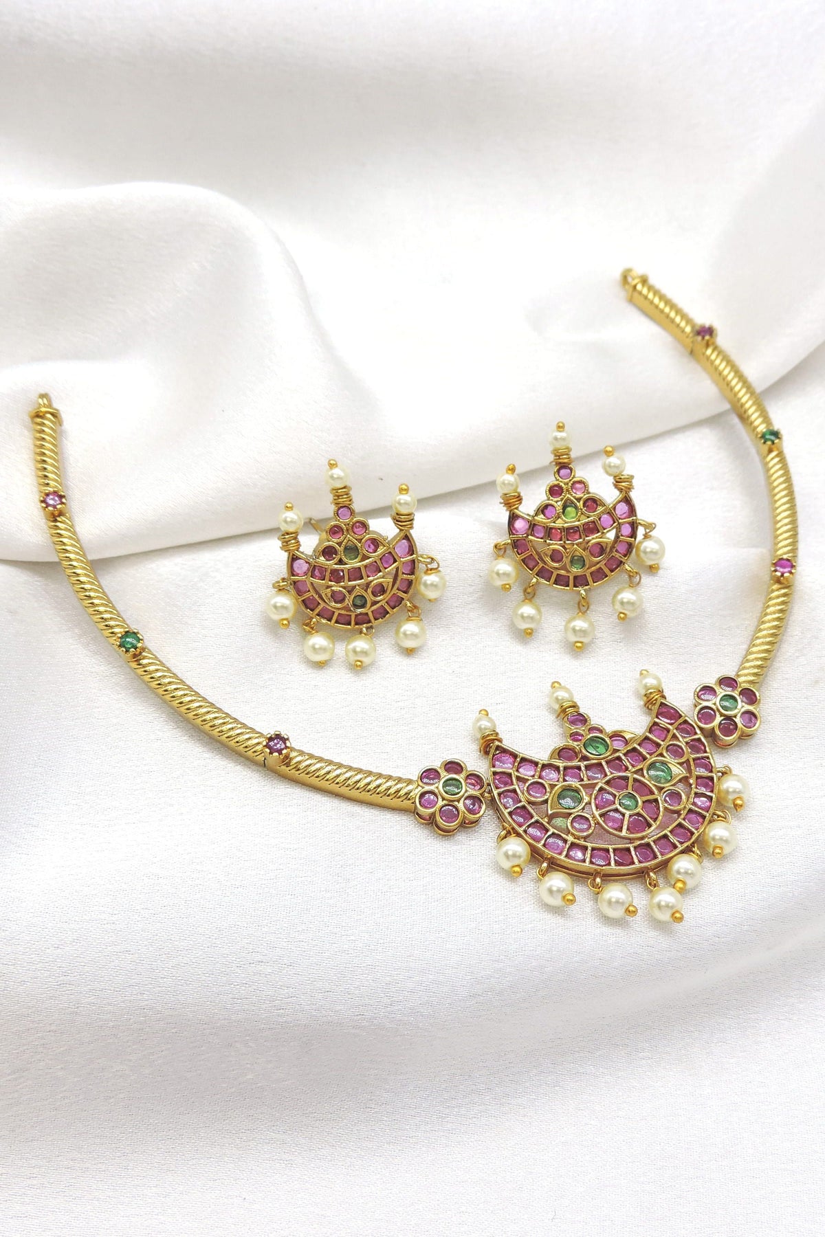 Traditional kundan chand pendant Hasli necklace set with pink and green stones and matching earrings by joyrias