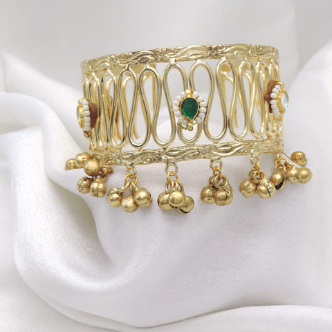 Gold-toned green stone ghungroo cuff bracelet with pearl detailing and dangling charms by joyrias