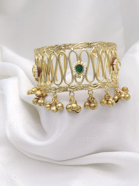 Gold-toned green stone ghungroo cuff bracelet with pearl detailing and dangling charms by joyrias