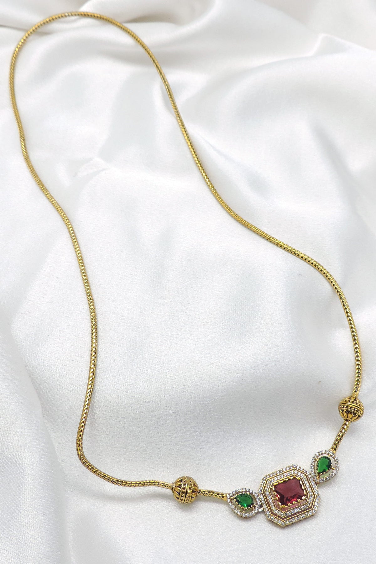 Gold-toned ruby green stone pendant necklace by joyrias