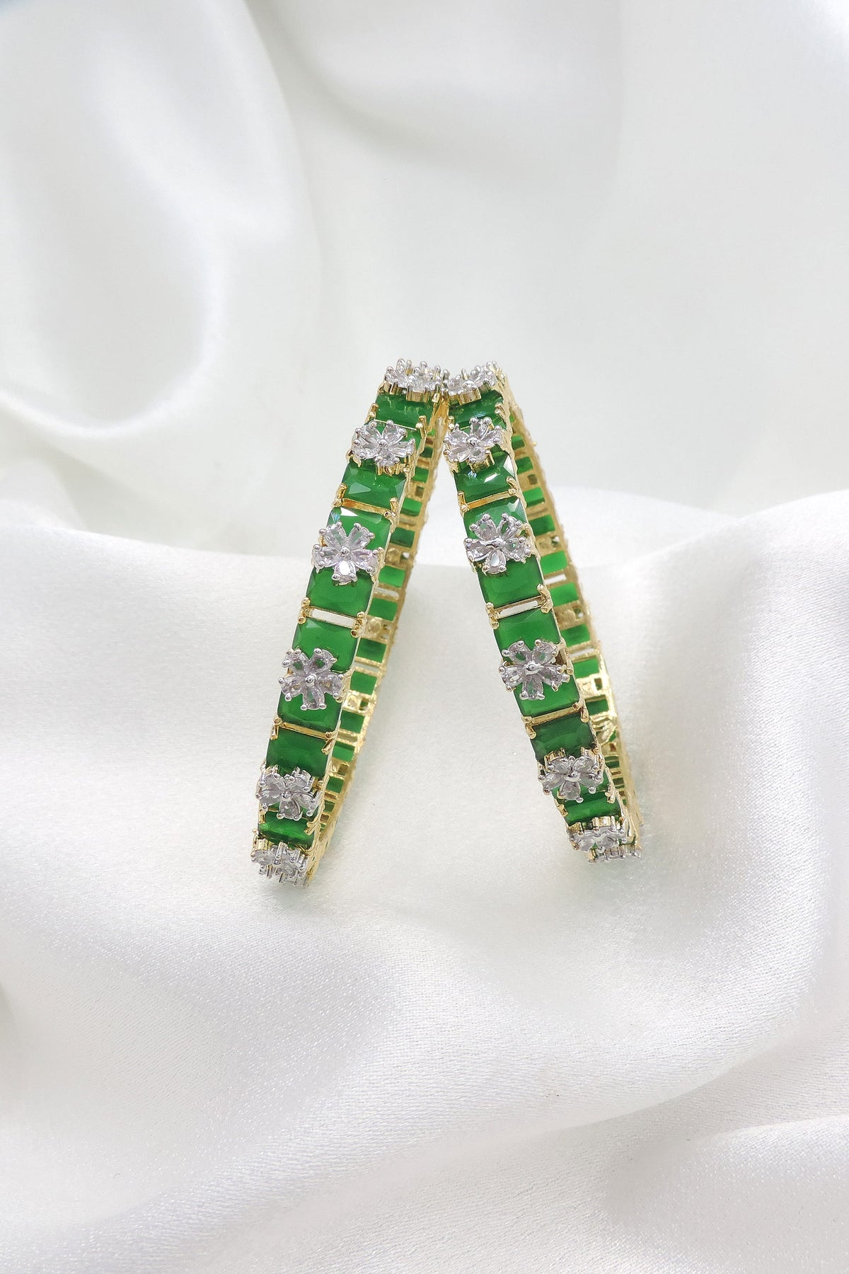 Graceful gold-toned green stone AD floral bangle set by joyrias