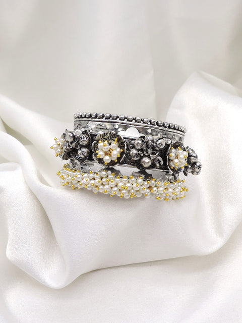 Oxidized silver pearl floral cuff bracelet with intricate detailing and gold-toned bead accents by joyrias