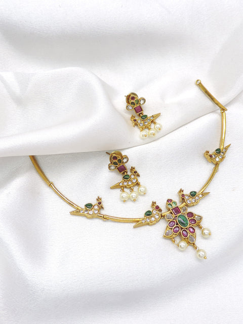 Inspire temple style gold-toned peacock choker necklace set with colorful stones, pearl detailing and matching earrings by joyrias