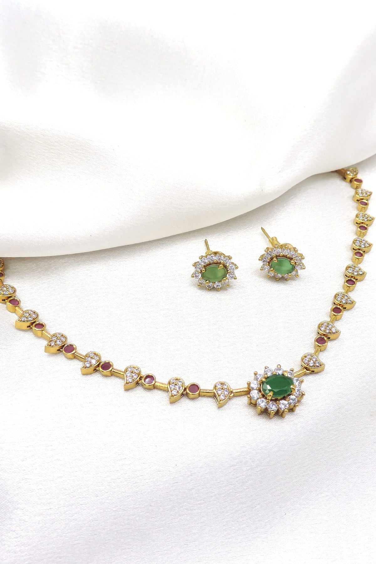 Gold-toned AD CZ changeable necklace set with green and ruby stones and matching earrings by joyrias