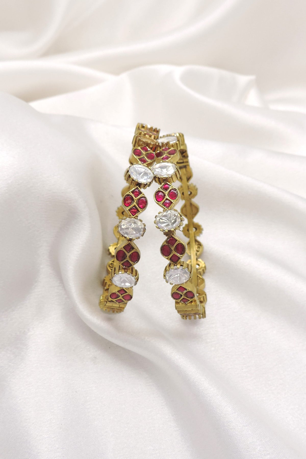 Gold plated ruby CZ AD bangle set with intricate detailing by joyrias