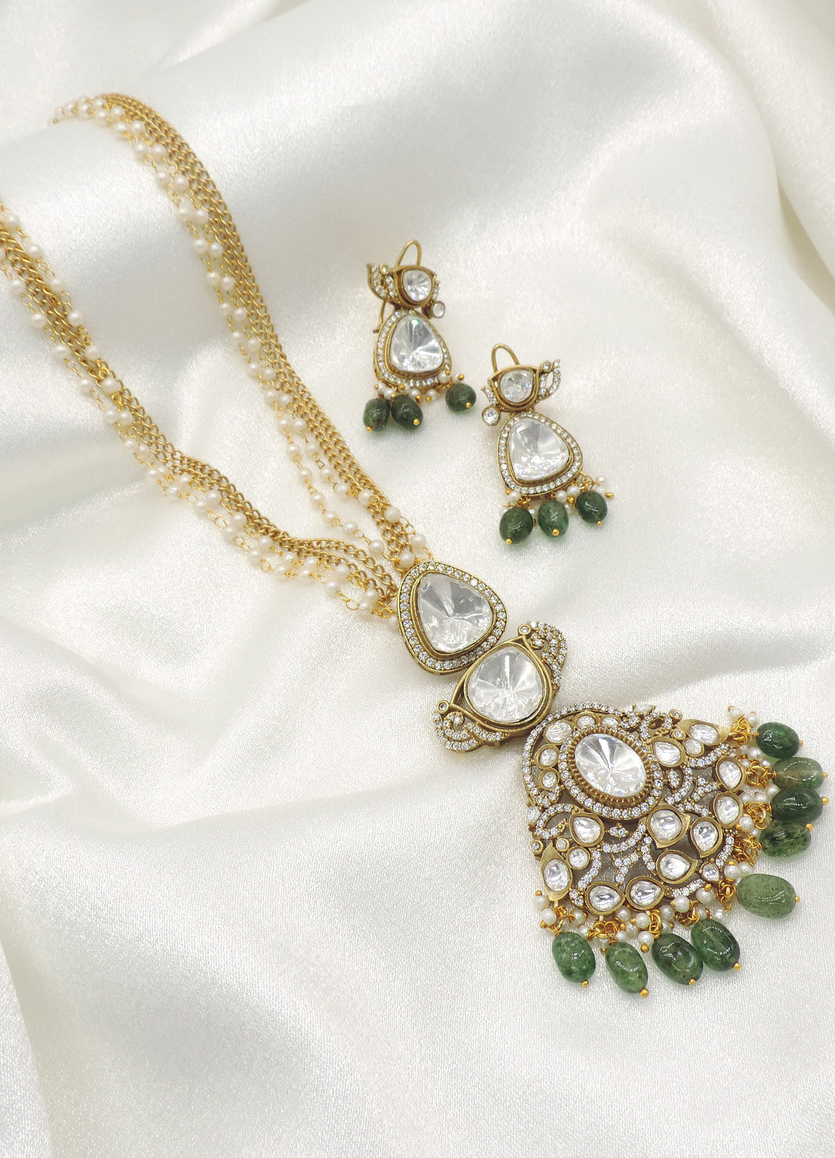 Green kundan pearl pendant set by Joyrias
