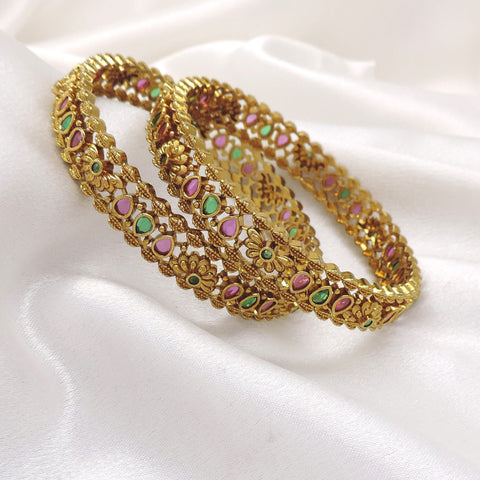 Ruby emerald floral bangle set with intricate gold-tone detailing by joyrias