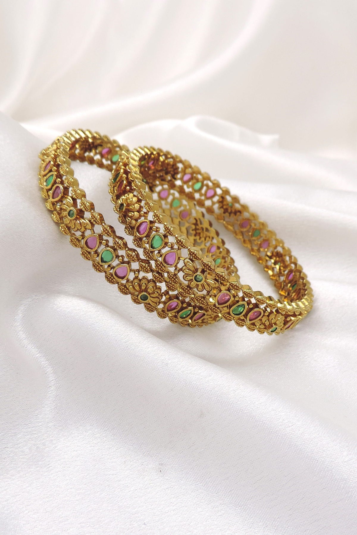 Ruby emerald floral bangle set with intricate gold-tone detailing by joyrias