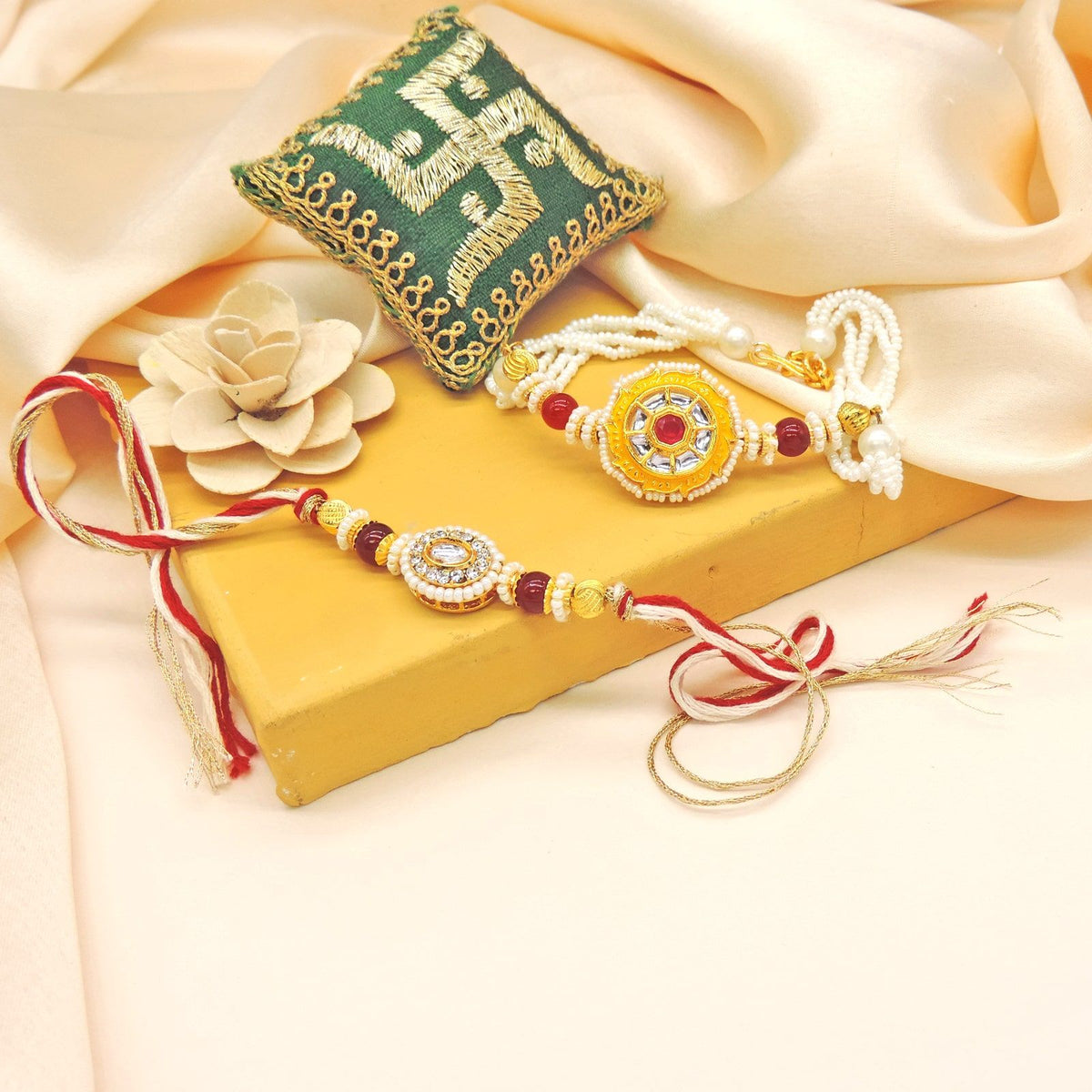 Sunburst Pearl Bhaiya Bhabhi Rakhi Set by Joyrias