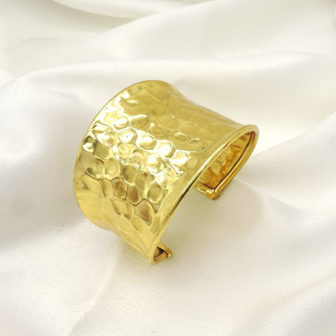Hammered gold wide cuff bracelet by Joyrias
