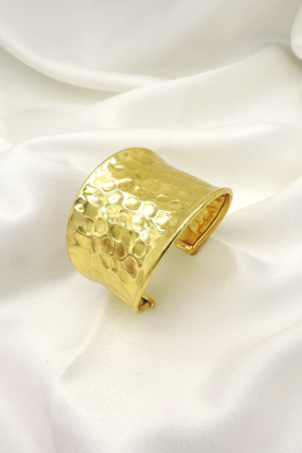 Hammered gold wide cuff bracelet by Joyrias