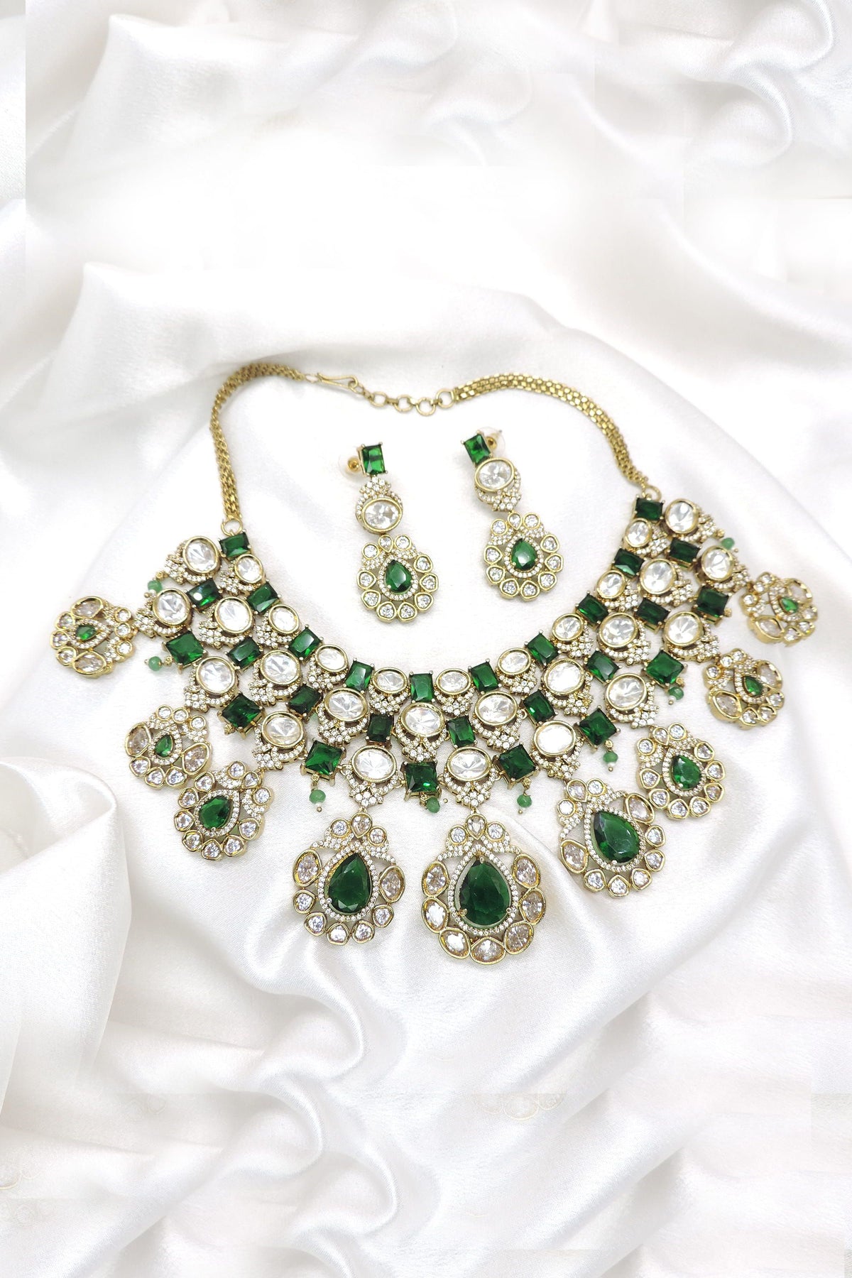 Emerald green AD CZ necklace set with clustered stone detailing and matching earrings by joyrias