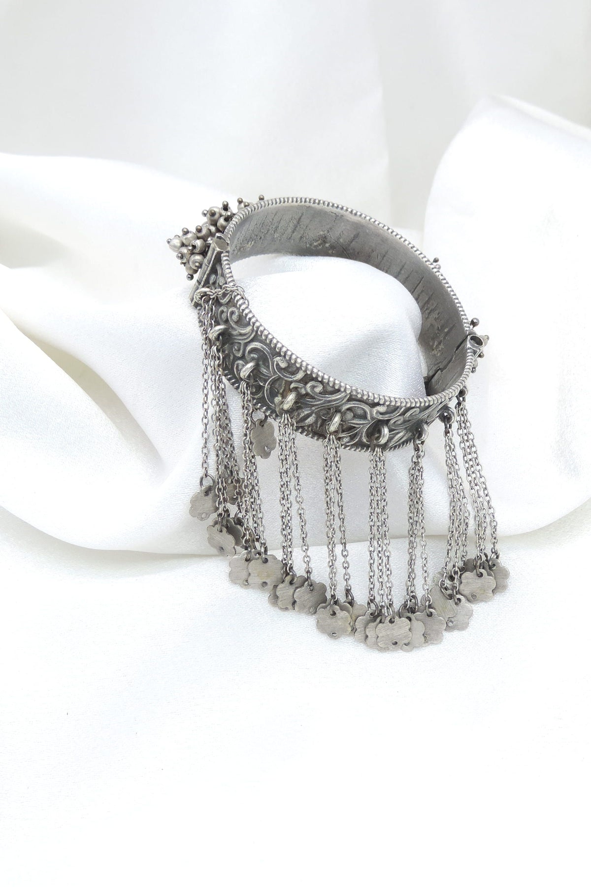 Oxidized silver long chain charm cuff bracelet with floral engraved detailing by joyrias