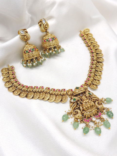 Gold plated ruby emerald temple necklace set with coin motifs and jhumka earrings by joyrias