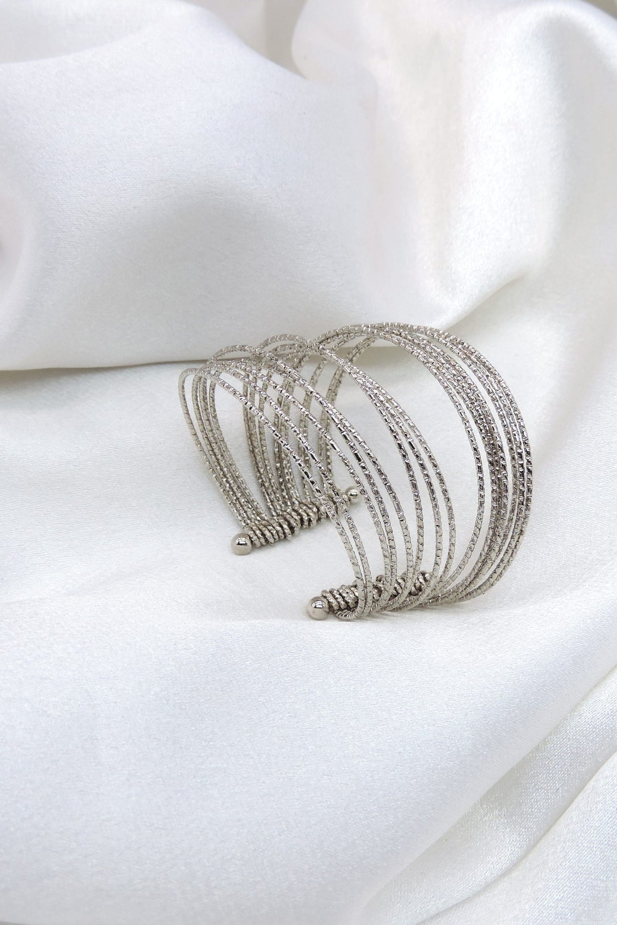 Oxidized silver multi-layer cuff bracelet with textured and twisted detailing by joyrias