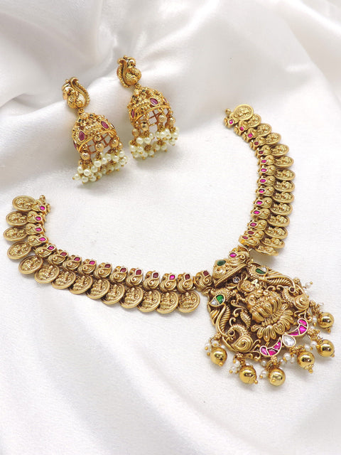 Ruby emerald gold plated temple necklace set with intricate coin motifs and jhumka earrings by joyrias