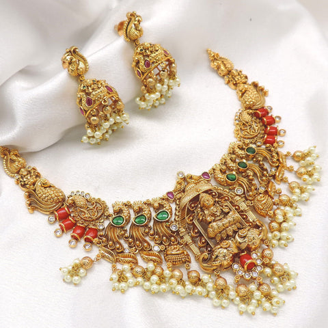 Ruby emerald gold plated traditional temple choker set with pearl drops and matching jhumka earrings by joyrias