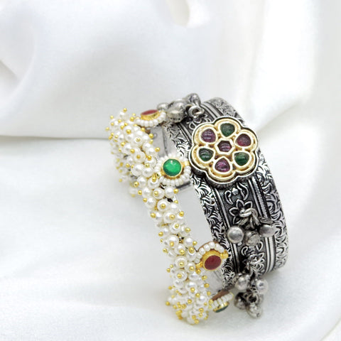 Oxidized dual-tone silver gold green pink pearl cuff bracelet with ornate floral detailing by joyrias