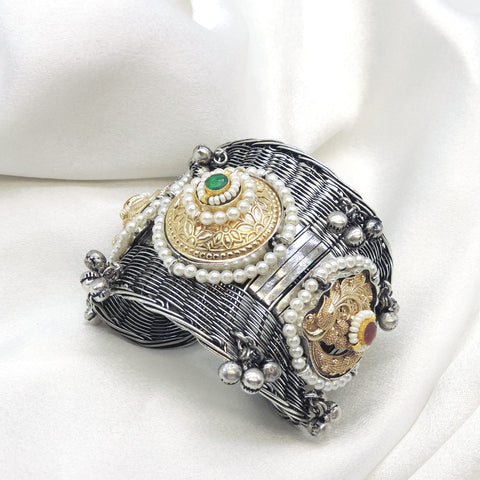 Oxidized dual-tone green stone pearl cuff bracelet with gold-toned detailing and silver bead charms by joyrias