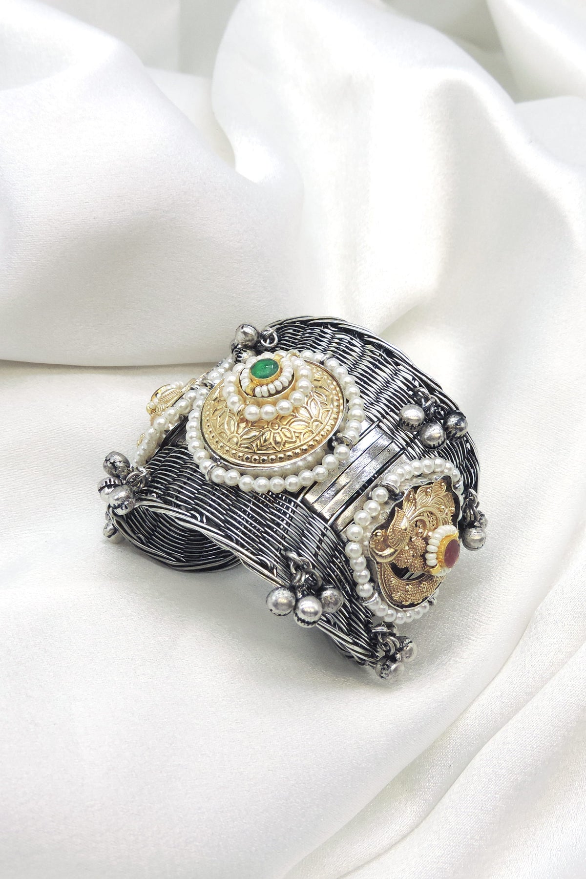 Oxidized dual-tone green stone pearl cuff bracelet with gold-toned detailing and silver bead charms by joyrias