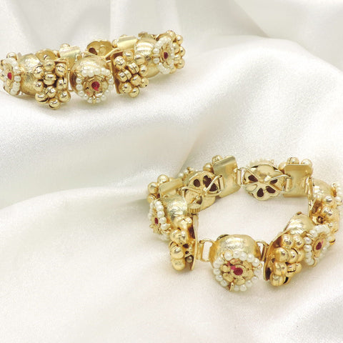 Antique pearl floral bangles by Joyrias