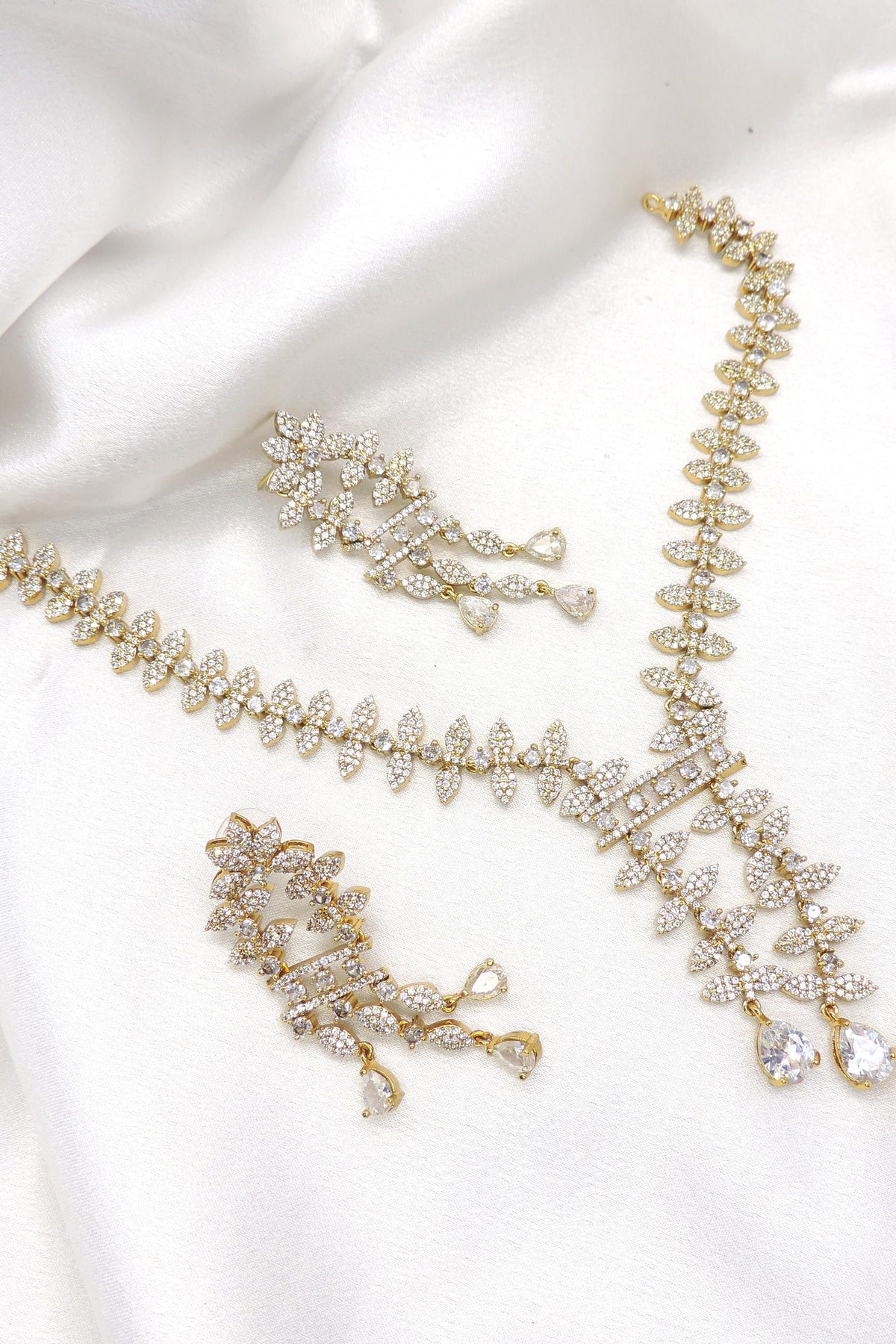 Radiant floral CZ necklace set with sparkling accents and matching earrings by joyrias