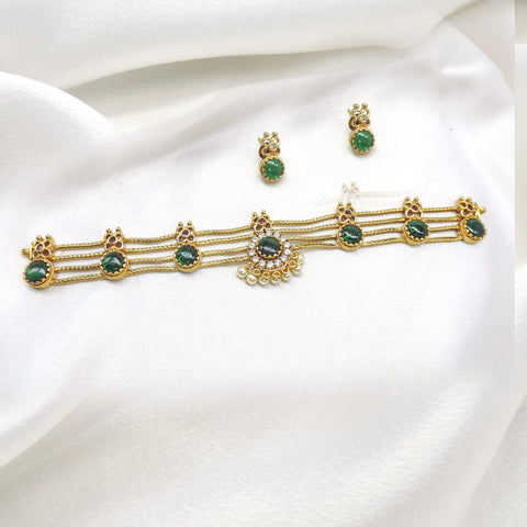 Gold plated palakka choker with green stones and matching stud earrings by joyrias