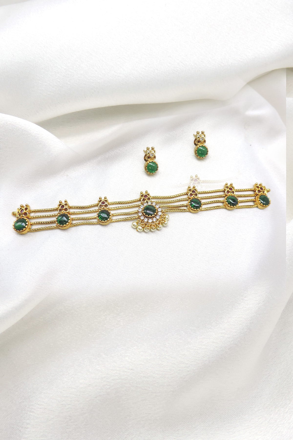 Gold plated palakka choker with green stones and matching stud earrings by joyrias