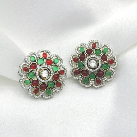 Multicolor kundan floral earrings with green and maroon stone detailing by joyrias
