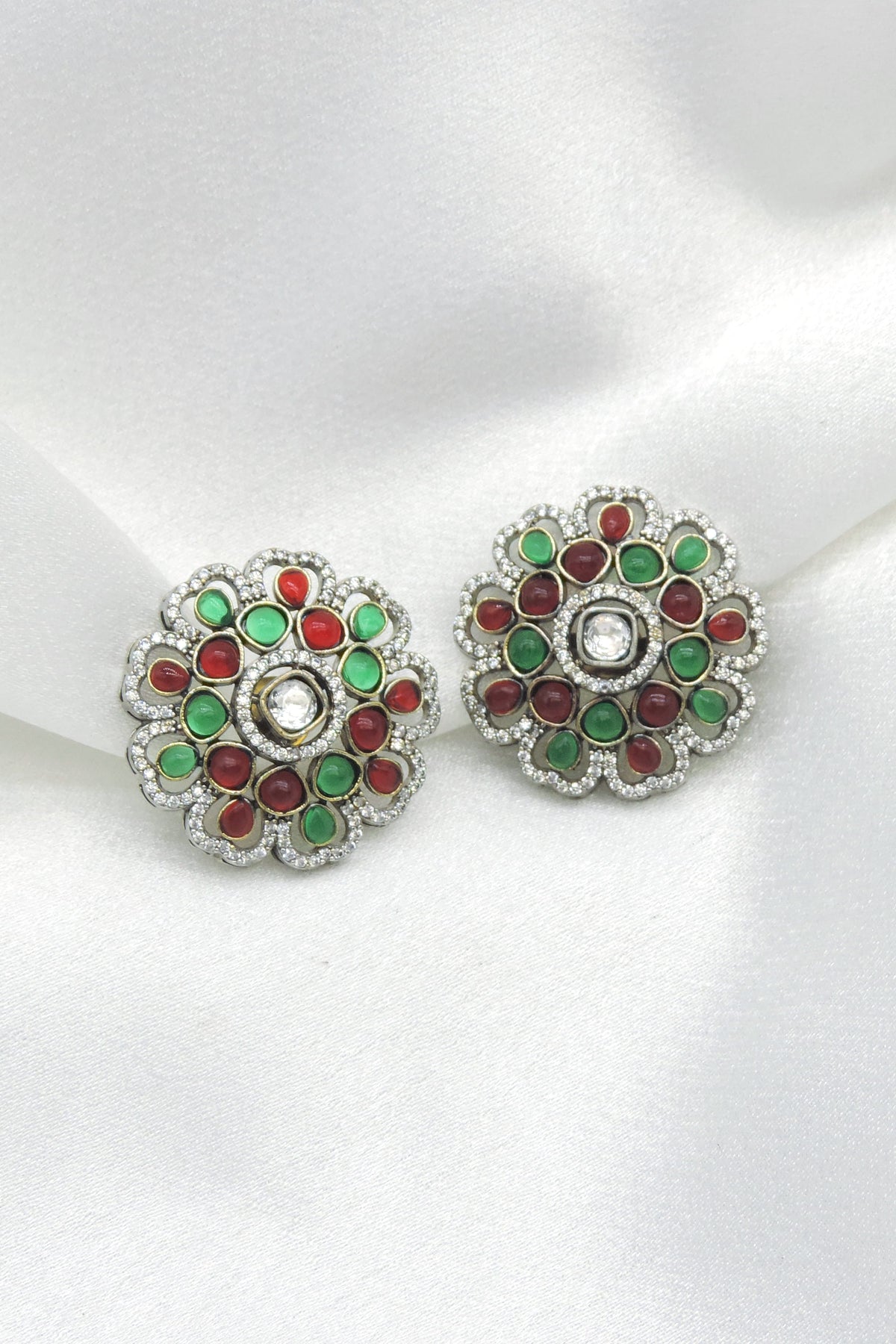 Multicolor kundan floral earrings with green and maroon stone detailing by joyrias