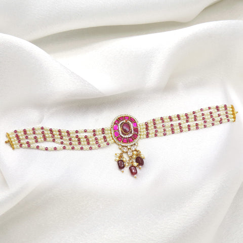 Ruby pearl beaded necklace with traditional centerpiece and delicate hanging accents by joyrias