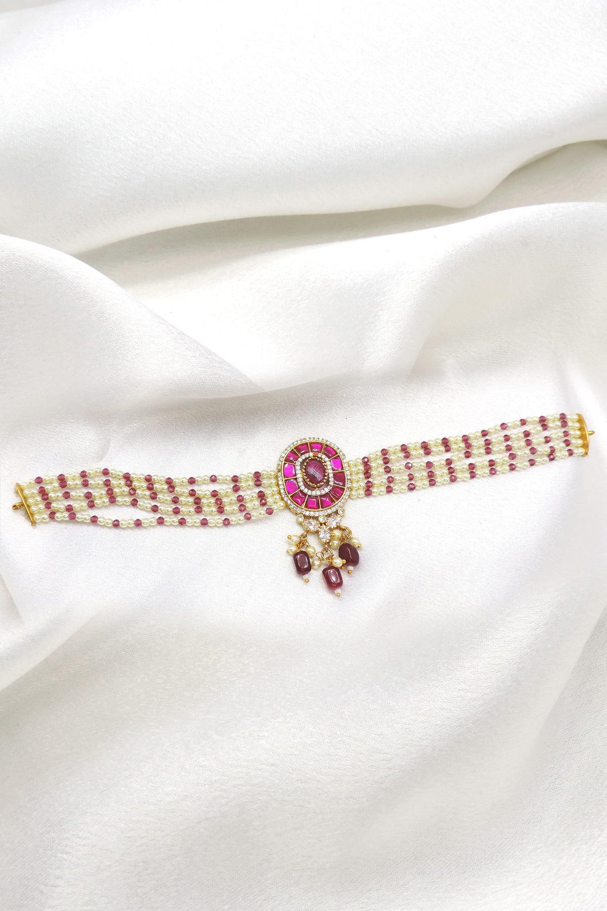Ruby pearl beaded necklace with traditional centerpiece and delicate hanging accents by joyrias