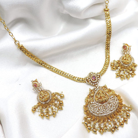 Traditional gold plated ruby CZ AD temple necklace set with ornate pendant, pearl drops and matching earrings by joyrias