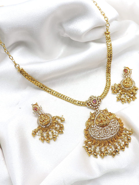 Traditional gold plated ruby CZ AD temple necklace set with ornate pendant, pearl drops and matching earrings by joyrias